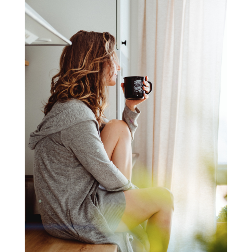 Woman sitting drinking coffee