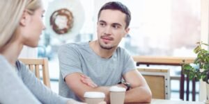 Man and woman sitting in cafe.