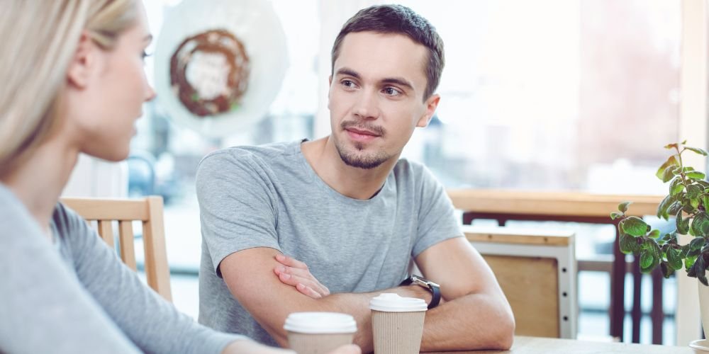 Man and woman sitting in cafe.